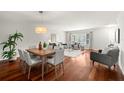Open-concept living and dining area featuring hardwood floors, neutral decor, and ample natural light at 2228 Swedish Dr # 22, Clearwater, FL 33763