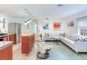 Open concept living area, hardwood floors, neutral decor, and stainless steel appliances at 246 22Nd Ne Ave, St Petersburg, FL 33704