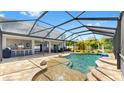 Screened-in lanai with large in-ground pool and spa, plenty of space for entertaining and relaxing at 2517 Cumberland Cliff Dr, Ruskin, FL 33570