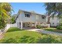 Inviting home with lush lawn, stilt foundation, and a charming exterior elevation at 4027 Alabama Ne Ave, St Petersburg, FL 33703