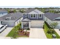 Well maintained two-story home with a two-car garage and a nicely landscaped front yard at 5437 Del Coronado Dr, Apollo Beach, FL 33572