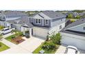 Well maintained two-story home with a two-car garage, nicely landscaped front yard and manicured lawn at 5437 Del Coronado Dr, Apollo Beach, FL 33572
