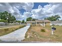 Inviting single-Gathering house with a long driveway and charming curb appeal at 5939 14Th St, Zephyrhills, FL 33542
