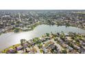 An aerial view that showcases homes near the lake, highlighting the community's access to waterfront recreation and relaxation at 7534 Culberson Dr, Port Richey, FL 34668