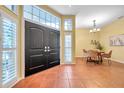 Open foyer with tile flooring, high ceilings, and a view of the dining area at 980 Live Oak Ne Ave, St Petersburg, FL 33703