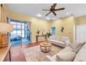 Bright living room features neutral decor, sliding glass doors, and stylish furnishings that offer relaxation at 980 Live Oak Ne Ave, St Petersburg, FL 33703