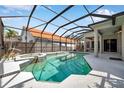 The screened-in pool and spa offer a luxurious outdoor experience with plenty of room to relax and enjoy the sunshine at 980 Live Oak Ne Ave, St Petersburg, FL 33703