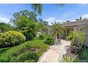 Attractive single-story home with well-manicured landscaping and a welcoming entrance at 10515 Hetrick W Cir, Largo, FL 33774