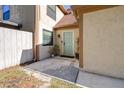Front entrance featuring a light blue door, small porch and garden space with a white fence at 16107 Dawnview Dr, Tampa, FL 33624