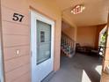Entrance to unit 57 with a door and staircase to other units at 2457 Ecuadorian Way # 57, Clearwater, FL 33763