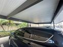 Assigned carport parking with number 1511 conveniently protects the vehicle from the elements at 2615 Cove Cay Dr # 408, Clearwater, FL 33760