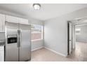 Bright kitchen area featuring stainless steel appliances, tile flooring and a window view at 2728 39Th N Ave, St Petersburg, FL 33714