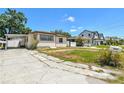 Cozy single-story home with a convenient carport in a residential neighborhood at 3007 Aileen W St, Tampa, FL 33607