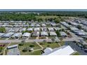 This aerial shot captures a well-maintained community with lush landscaping and convenient parking at 35149 Wagner Way, Zephyrhills, FL 33541