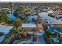 Stunning aerial view of this home showcases its prime waterfront location with waterway access and a beautiful community at 4772 Dover Ne St, St Petersburg, FL 33703