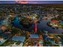 Desirable location with waterway access in a quiet community featuring a waterfront property with palm trees and lush landscaping at 4772 Dover Ne St, St Petersburg, FL 33703
