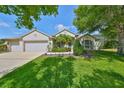 Lovely single-story home with well-kept lawn, beautiful landscaping, and a three-car garage at 6107 Heroncrest Ct, Lithia, FL 33547