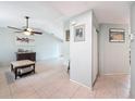Open-concept living room with tile flooring and neutral paint, providing a welcoming atmosphere at 7237 Bramblewood Dr, Port Richey, FL 34668