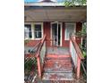 Close-up of the front steps, porch, and front door at 7807 N Mulberry St, Tampa, FL 33604