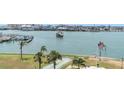 Waterfront condo with shuffleboard court, palm trees, and a marina, near dining and entertainment at 1 Key Capri # 502E, Treasure Island, FL 33706