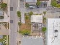 Birds eye view of a property highlighting the proximity to shops and restaurants, with a screened-in pool at 101 11Th Ave, St Pete Beach, FL 33706