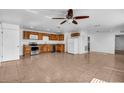 Spacious kitchen with stainless steel appliances, wood cabinetry, and tile flooring at 10701 Village Green Ave, Seminole, FL 33772