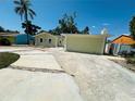 Wide concrete driveway leading to the attached garage, providing ample parking space at 1101 Alcazar S Way, St Petersburg, FL 33705