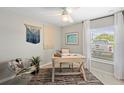 Bright office with a modern desk, stylish decor, and a large window with natural light at 118 Leisure Pl, Rotonda West, FL 33947