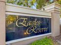 Eagles Reserve community sign featuring elegant gold lettering against a classic dark background and greenery at 1768 Lago Vista Blvd, Palm Harbor, FL 34685