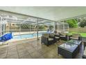 Covered patio space with neutral patio furniture in screened in lanai at 1829 1St E Ave, Bradenton, FL 34208