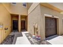 Exterior view of townhome entryways and attached garage doors at 1984 Hawks View Dr, Ruskin, FL 33570