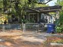 Cozy bungalow with covered porch and fenced yard, featuring ample space for outdoor entertaining at 3503 N 11Th St, Tampa, FL 33605