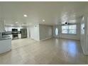 Open-concept living area features tile flooring and ample natural light at 4322 Baden Dr, Holiday, FL 34691