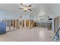 A view of the kitchen area featuring tile floors, white cabinets and modern appliances at 6750 Hibiscus S Ave, South Pasadena, FL 33707
