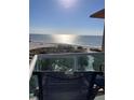Serene balcony view overlooking the beach and ocean, inviting relaxation and tranquility at 880 Mandalay Ave # S302, Clearwater Beach, FL 33767