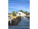 Charming single-story home featuring a well-maintained front yard and attached garage in a residential neighborhood at 13018 Clay Ave, Largo, FL 33773