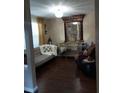 Inviting living room with elegant decor, ornate mirror, and stylish furniture at 13020 Lorna Pl, Tampa, FL 33618