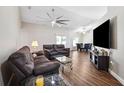 Comfortable living room featuring hardwood floors and plenty of natural light at 13040 Hanley Dr, Spring Hill, FL 34609