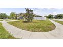 Well maintained yard with a privacy fence and lush landscaping at 18677 Milton Keynes Ct, Land O Lakes, FL 34638
