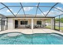 Beautiful screened-in pool area with a covered patio and plenty of seating for entertaining at 21834 Southern Charm Dr, Land O Lakes, FL 34637