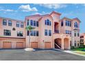 Beautiful multi-story condo building featuring private garages and a classic Mediterranean-style design at 2755 Via Capri # 1223, Clearwater, FL 33764