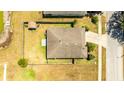 Birds-eye view of a fenced backyard with a patio, shed, and well-maintained lawn at 3406 Pearl Dove Ln, Plant City, FL 33567