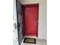 Exterior view of a red front door with black screen and welcome mat in an entryway at 4022 Cortez Dr # A, Tampa, FL 33614