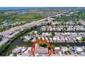 Aerial view showing the property's location on a canal with easy access to the open bay and the city at 5806 Liverpool Dr, Tampa, FL 33615