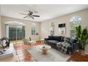 Bright living room featuring tile floors, neutral walls, arched windows and a glass sliding door to the outside at 8101 Interbay Blvd # A, Tampa, FL 33616