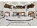 Elegant lobby featuring high ceilings, columns, and a circular design with decorative railings at 1560 Gulf Blvd # 306, Clearwater Beach, FL 33767