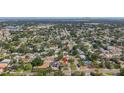 Overhead view showcasing neighborhood landscape with mature trees and proximity to urban skyline at 2001 Pinellas Point S Dr, St Petersburg, FL 33712