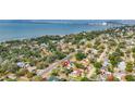 Beautiful aerial view of a neighborhood, showing lush landscaping, nearby beach, and waterfront living at 2001 Pinellas Point S Dr, St Petersburg, FL 33712