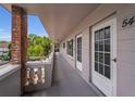 Hallway with unit doors, and outdoor view at 2460 Persian Dr # 54, Clearwater, FL 33763