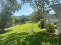Spacious backyard with lush green lawn and scenic lake view at 4074 Parkway Blvd, Land O Lakes, FL 34639